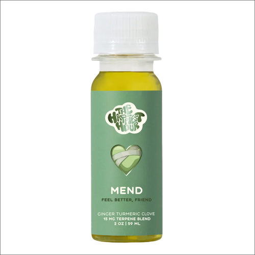 A bottle of 'MEND' terpene-infused beverage with ginger-turmeric flavor, designed for recovery and soothing sore muscles.