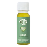 A bottle of 'MEND' terpene-infused beverage with ginger-turmeric flavor, designed for recovery and soothing sore muscles.